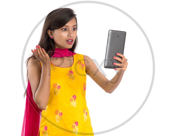 Young Indian Girl or Woman Speaking in a  Video Call   With an Expression On an Isolated White Background