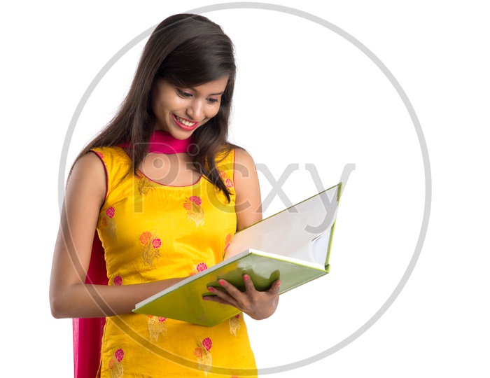 Young Indian Girl Student  Holding Books And Posing  On an Isolated White Background