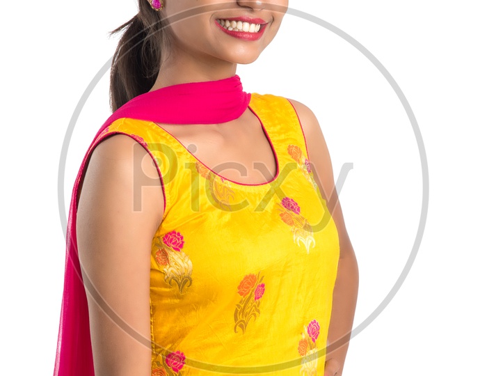 Young Indian Girl Or Woman Smiling Happily And Posing On an Isolated White Background