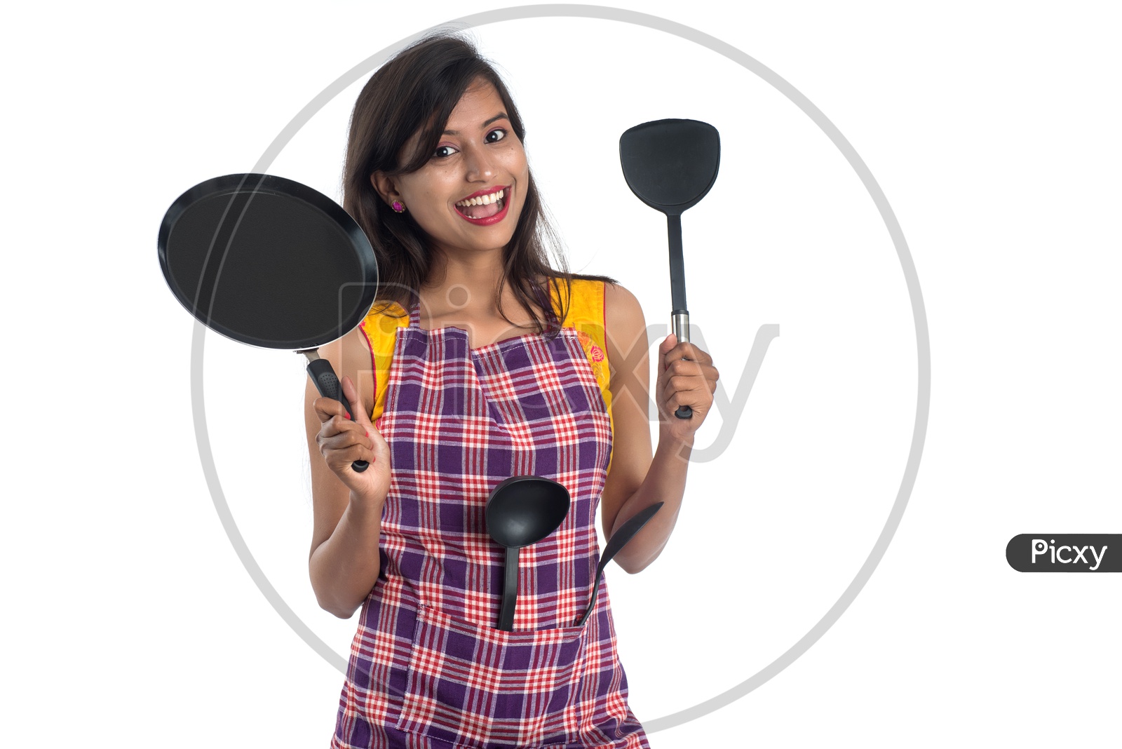 Young Indian Woman Or House Wife Or Girl With Cooking utensils And Posing On an Isolated White background