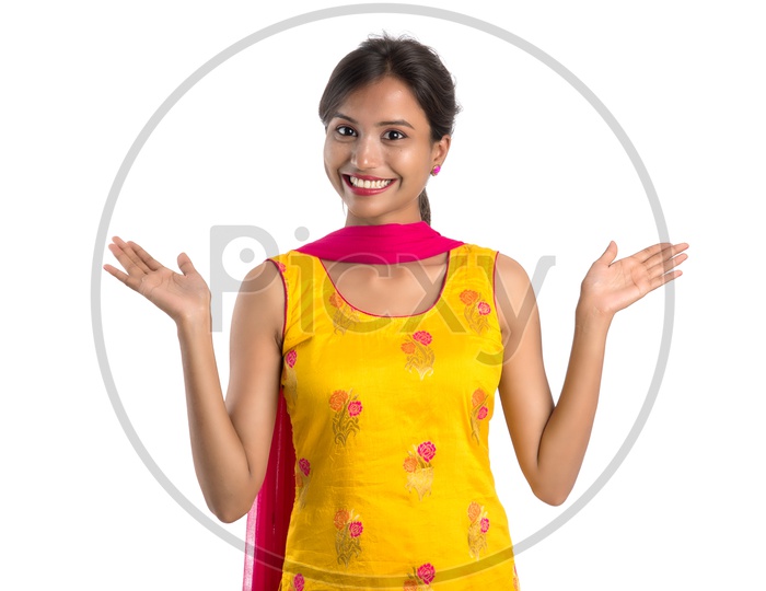 Young Indian Girl Or Woman Smiling Happily And Posing On an Isolated White Background