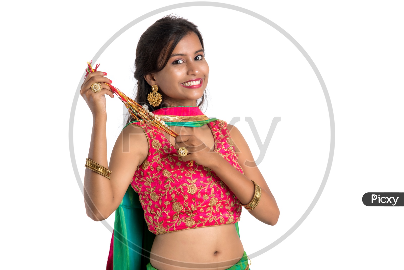 Young Indian Girl Or Woman Or Sister Holding Rakhi  With Expressions On an Isolated White Background