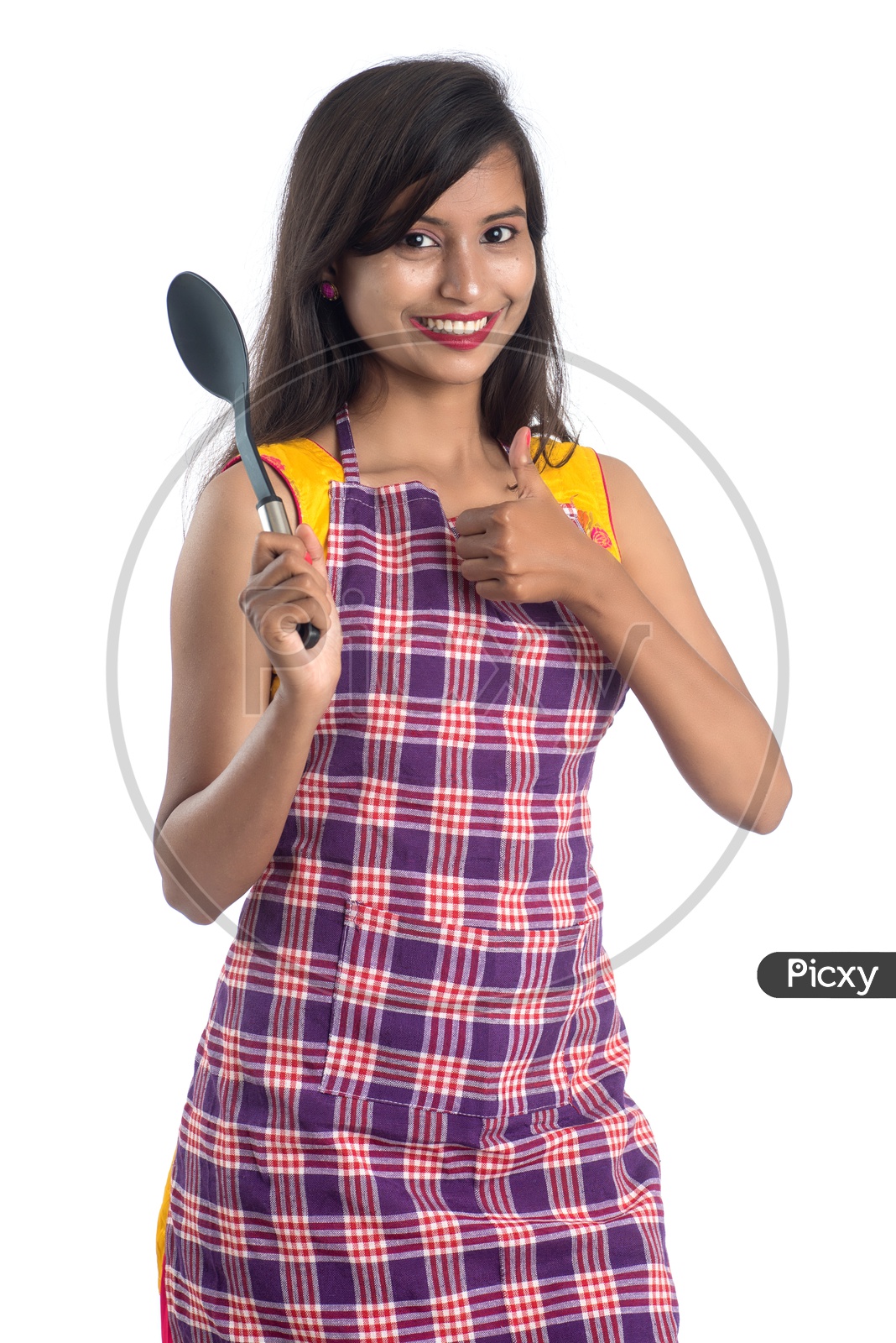 Young Indian Woman Or House Wife Or Girl With Cooking utensils And Posing On an Isolated White background