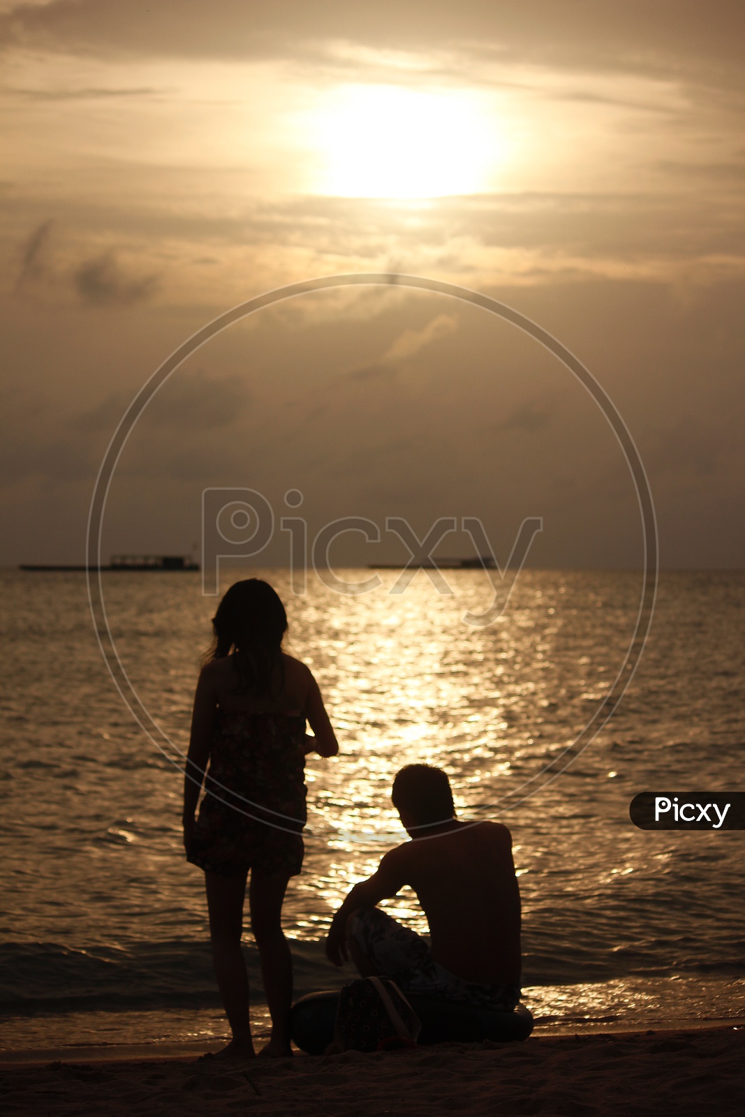 A couple enjoying the sunset in Pattaya beach
