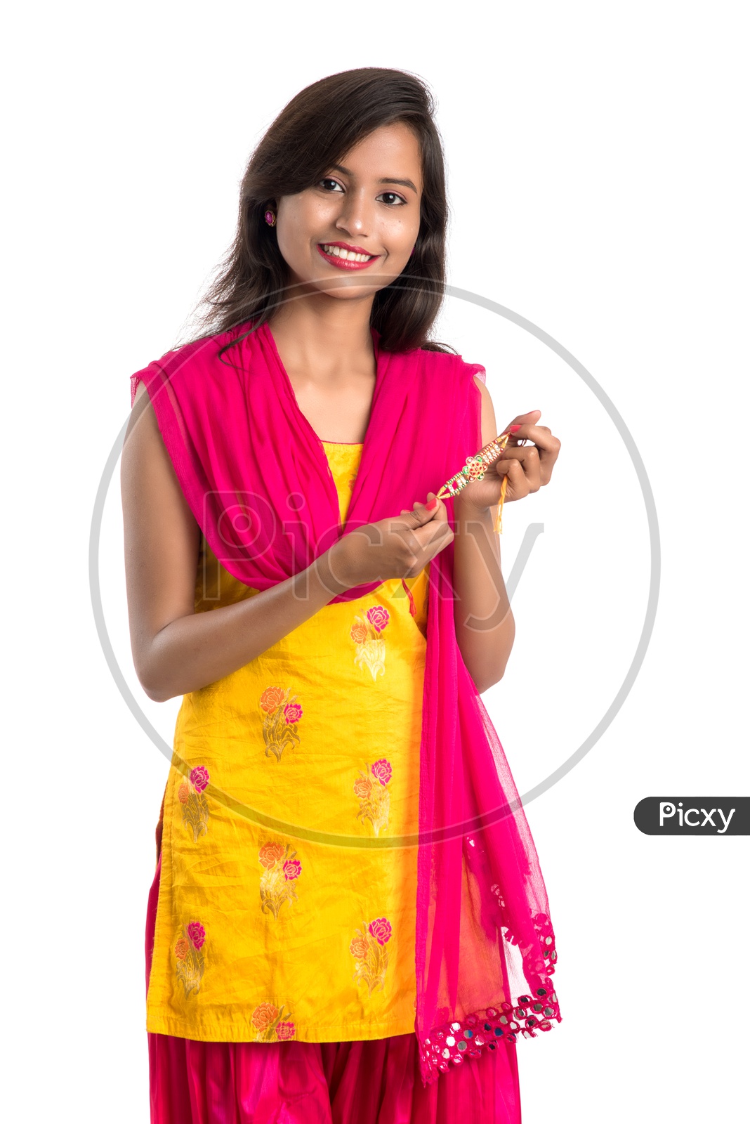 Young Indian Girl Or Woman Or Sister Holding Rakhi  With Expressions On an Isolated White Background 
Young Indian Girl Or Woman Or Sister Holding Rakhi  With Expressions On an Isolated White Background