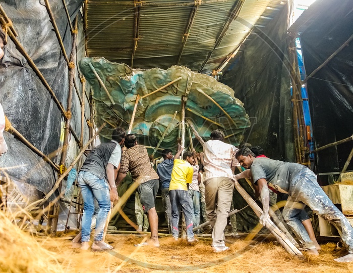 Ganesh idol making at Dhoolpet, After Attaching all clay and Grass on Mould they are lifting up. Idols getting Ready for Vinayaka Chaturthi, Ganesh Mould, Ganesh preparing by plaster of paris, Preparing of Ganesh Idol for Ganesh Chathurthi