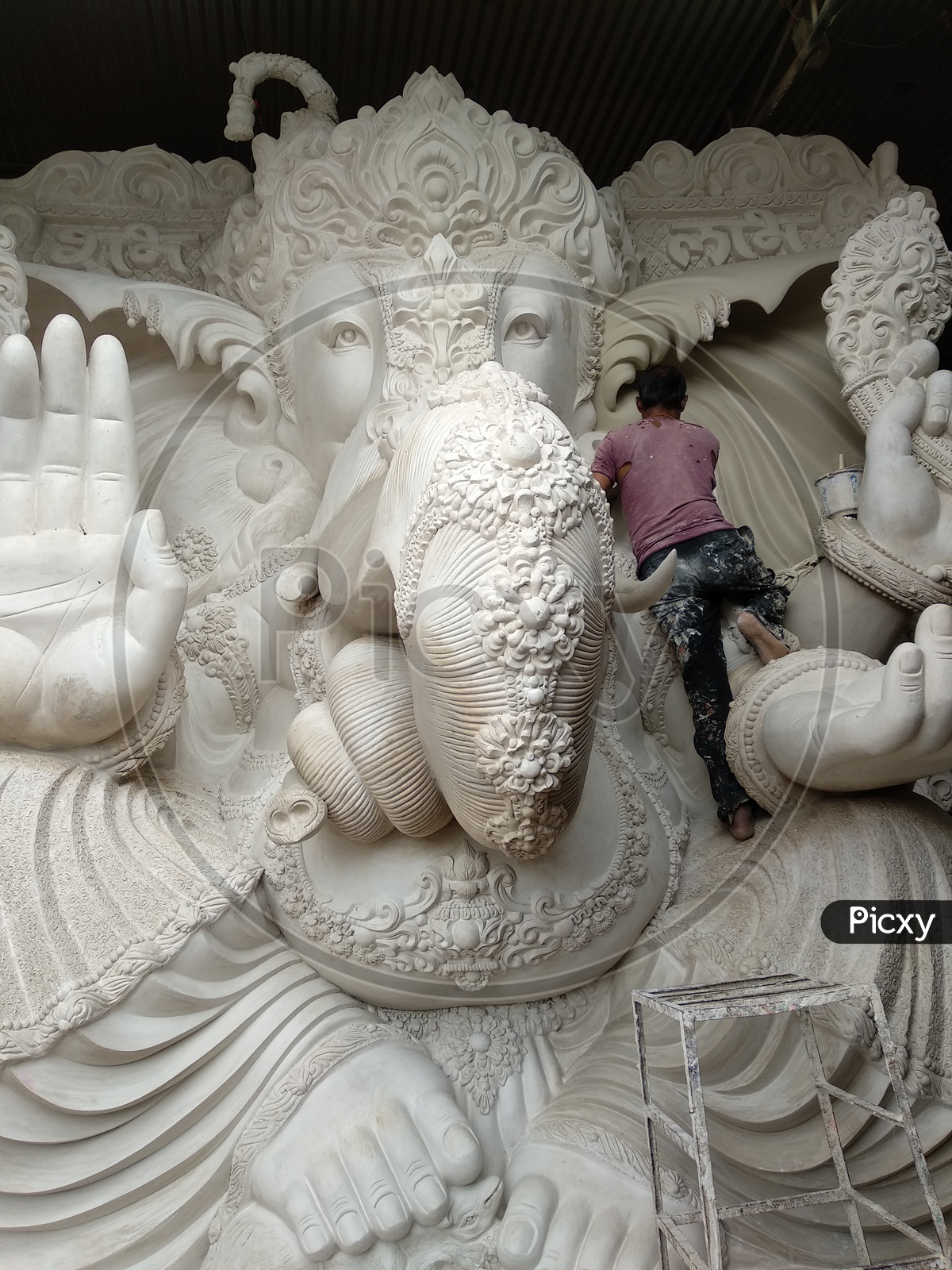 Ganesh idol making at Dhoolpet, A Man doing Finishing the Idol