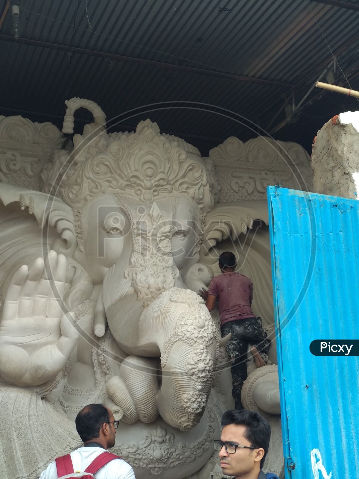 Prepartion of Ganesh Idol for Ganesh Chathurthi. A man working on idol for Vinayaka Chaturthi