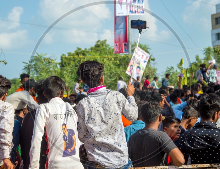 People Taking Selfies Using Selfie Stick At  Dahi Handi Festival