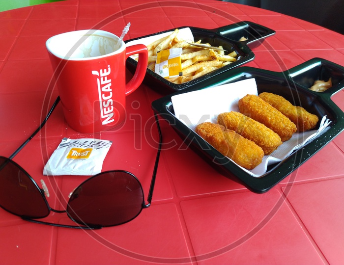 Snacks And Coffee Cup On an Table
