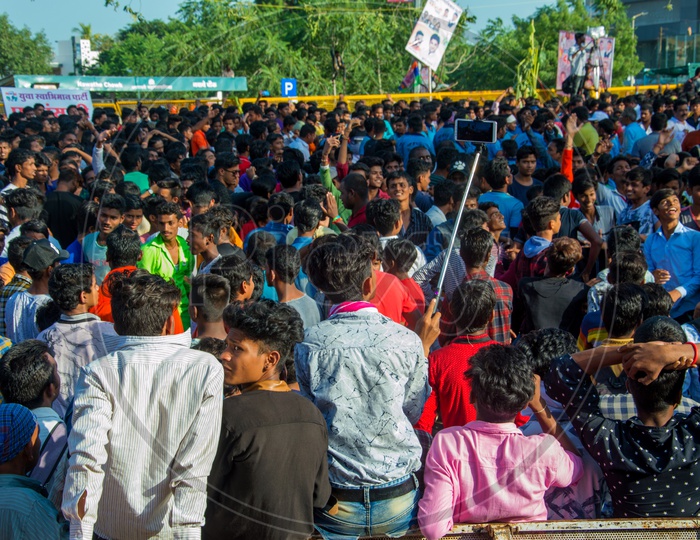 Crowd Of Young Indian People Enjoying And Dancing  Govinda  At The Dahi Handi Festival  To Celebrate Lord  Krishna's Birth Aniversary  Gokul Ashtami Or Krishna Ashtami