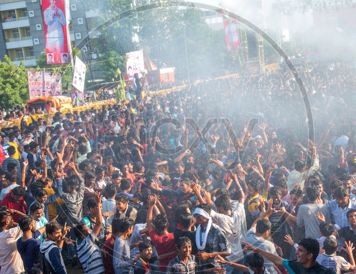 Crowd Of Young Indian People Enjoying And Dancing  Govinda  At The Dahi Handi Festival  To Celebrate Lord  Krishna's Birth Aniversary  Gokul Ashtami Or Krishna Ashtami