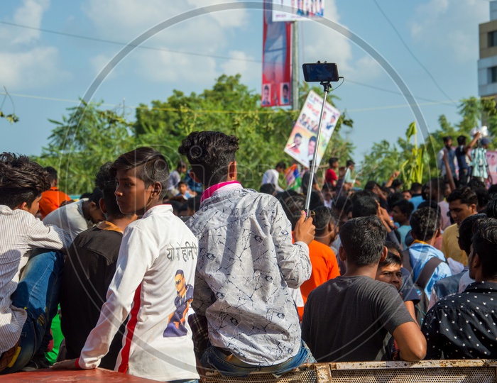 People Taking Selfies Using Selfie Stick At  Dahi Handi Festival