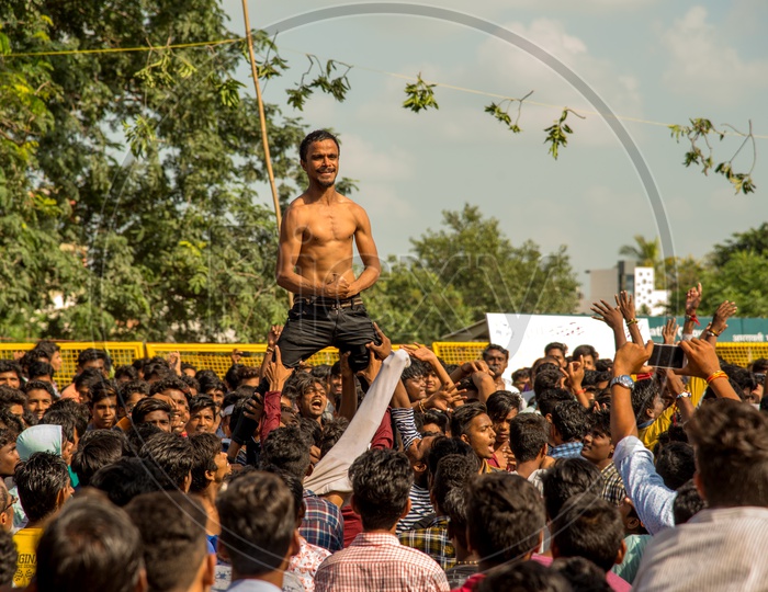 Crowd Of Young Indian People Enjoying  Govinda  At The Dahi Handi Festival  To Celebrate Lord  Krishna's Birth Aniversary  Gokul Ashtami Or Krishna Ashtami
