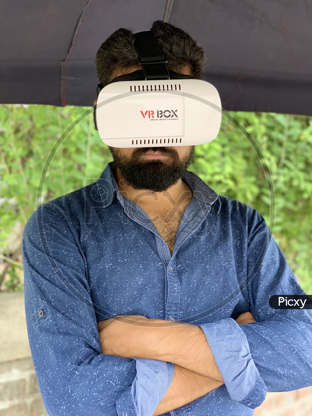 Beard man using VR box