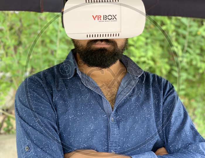 Beard man using VR box