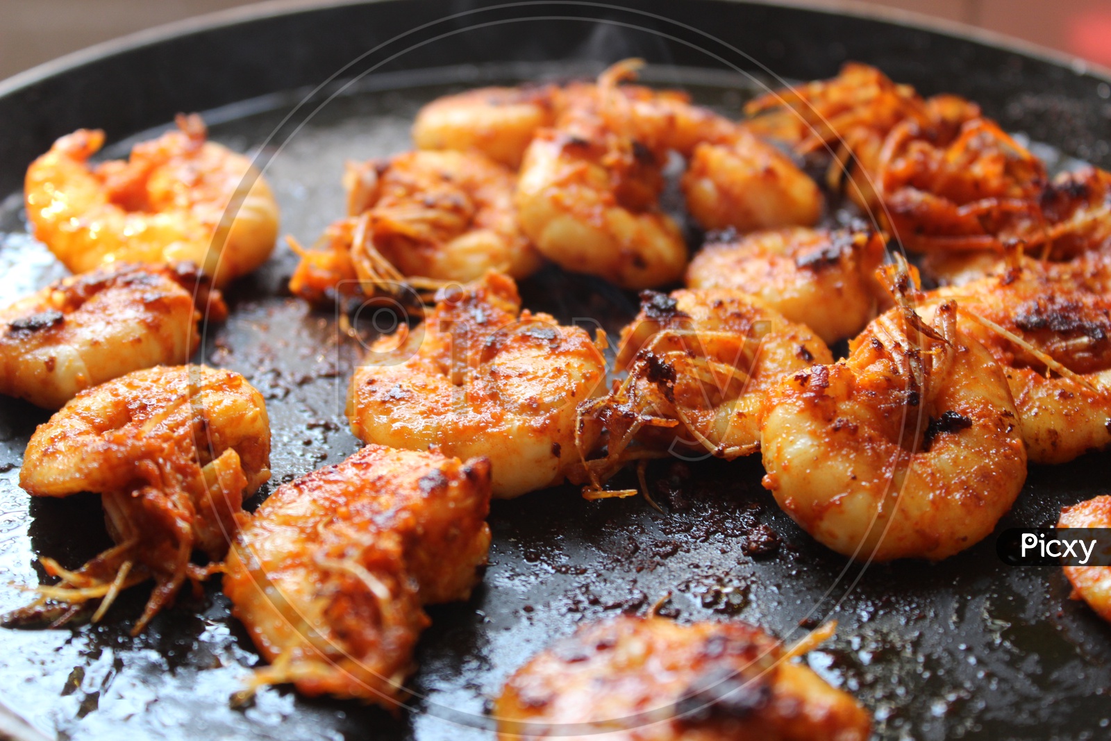 Prawns cooked on a non stick pan.