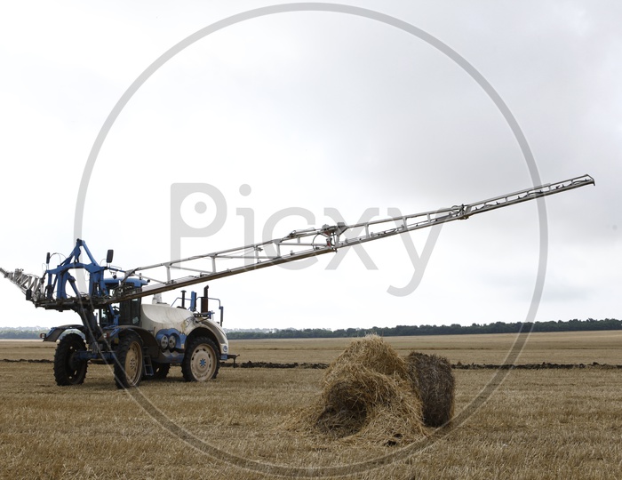 Paddy Harvesting machines in Agricultural Fields