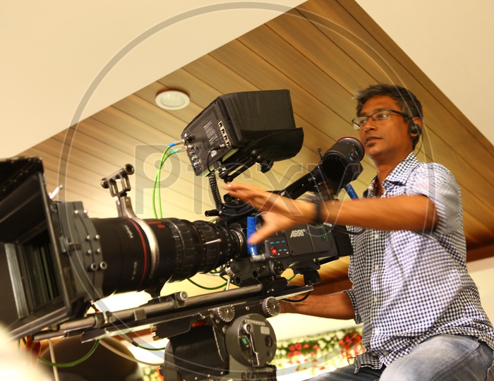 Cinematographer Behind The Camera In a Movie Shooting