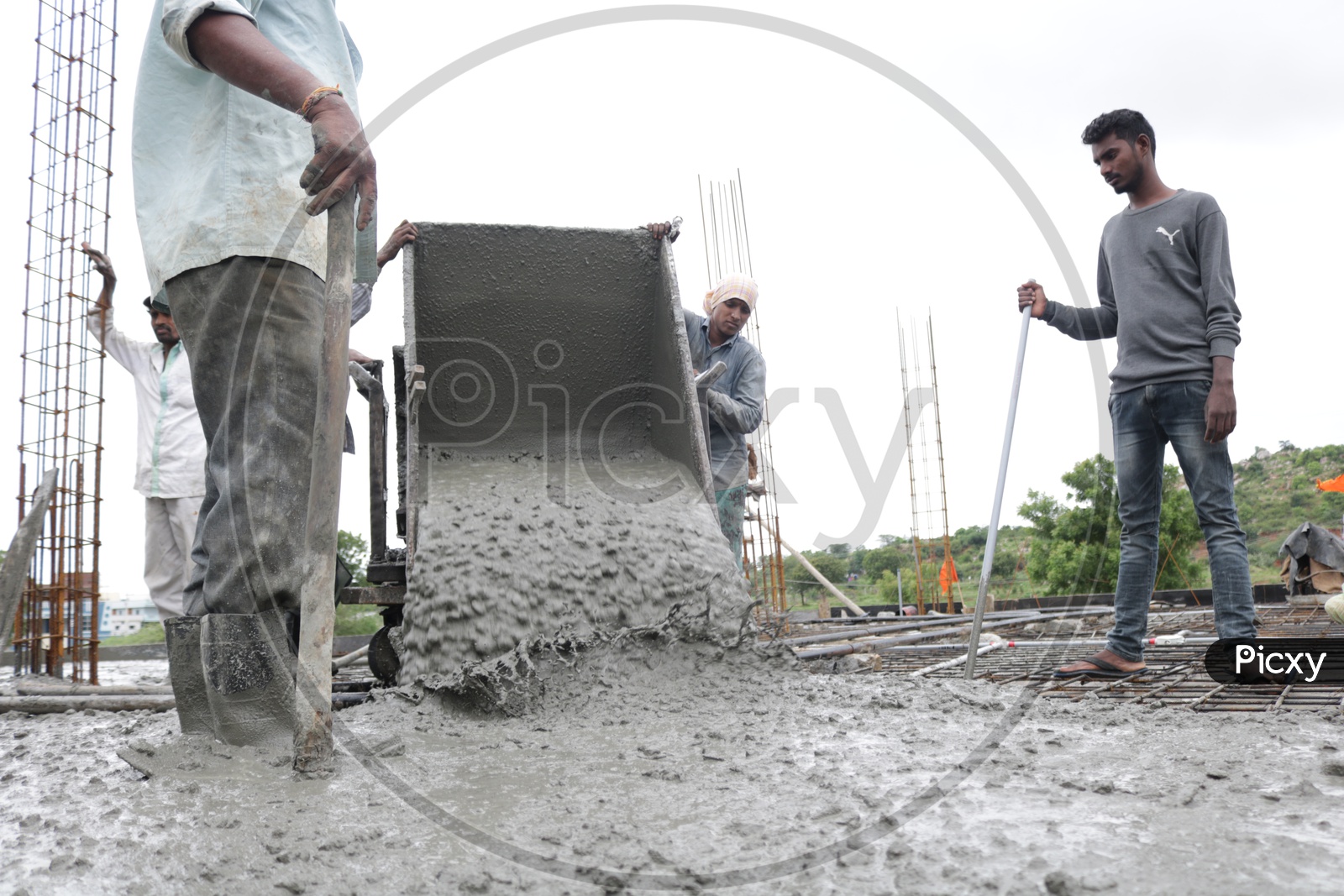concrete being poured at construction site