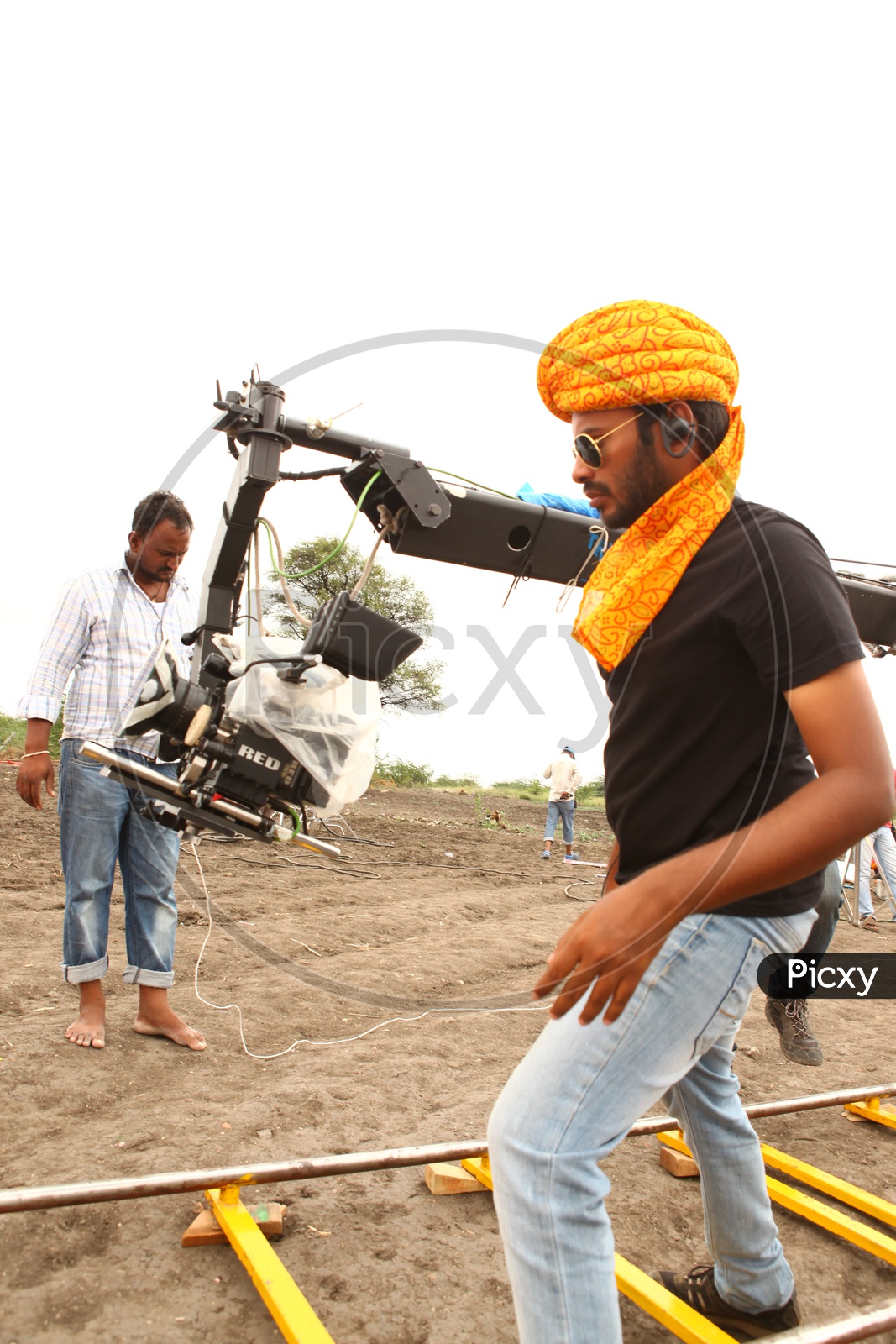 Image of Cinematographer Working On Behind Cameras During Movie Image of Cinematographer Working On Behind Cameras During Movie