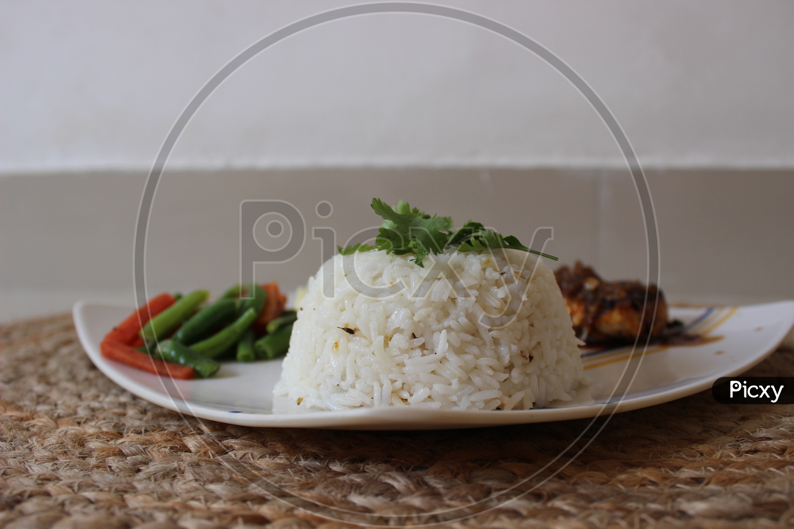 Rice dome garnished with coriander