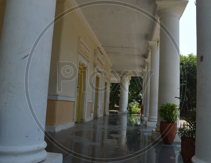 Corridor Of a House With Pillars