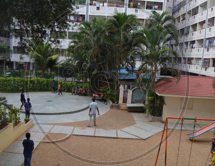 Children Playing in Amusement Area At Residential Flats Apartments