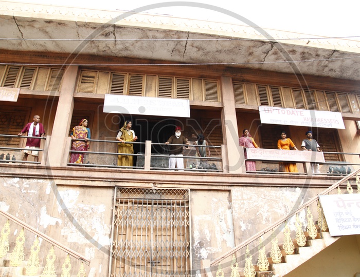 Residents Looking From House Balconies