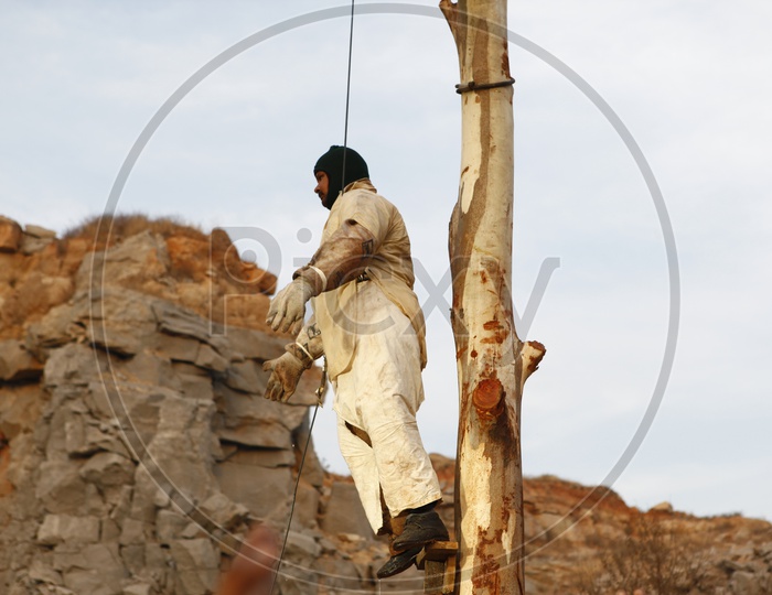 A Man Hanging Publicly In a Rural Village