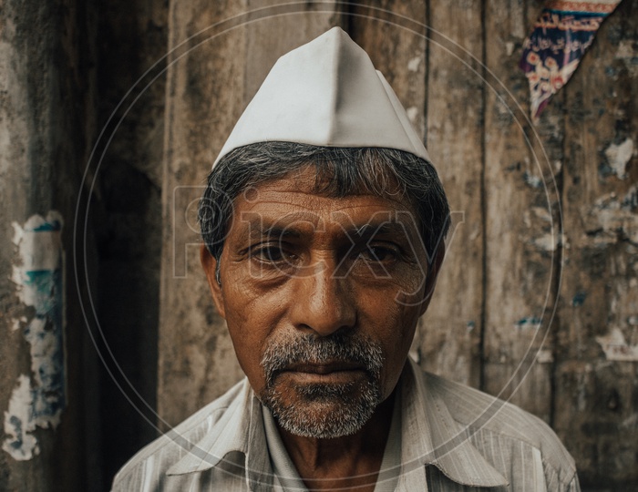 portrait shot of a marathi man from the streets of charminar