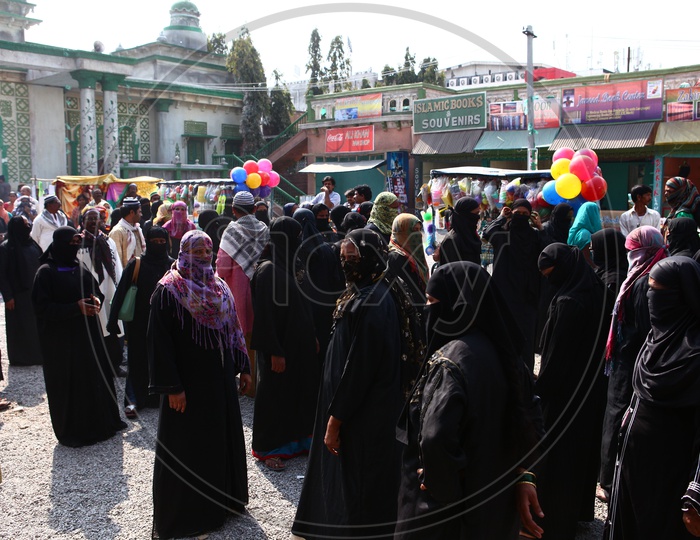 A Busy Street Or Vendor Street With Muslim  Woman
