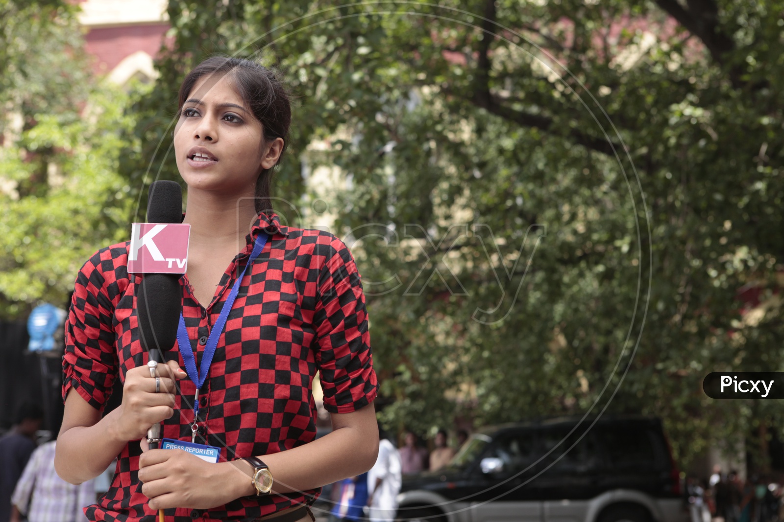 TV Reporter Or News Media Or Lady Reporter Reporting From a  Protest