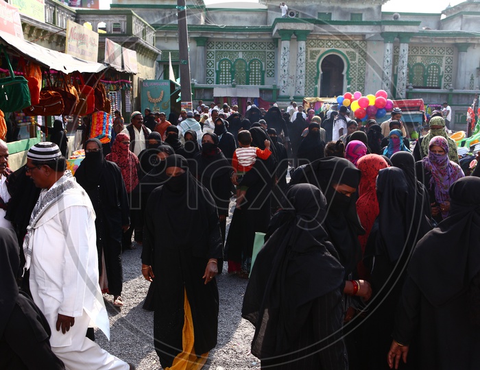 Muslim Woman Busily Shopping In a vendor Street