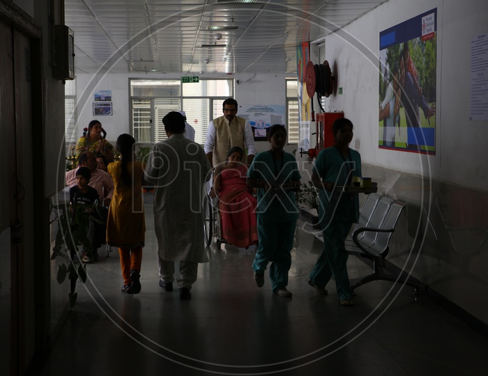 Patients In Wheel Chairs in a Hospital Corridor