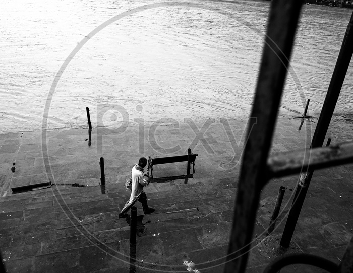 Man walking on the banks of Ganga.