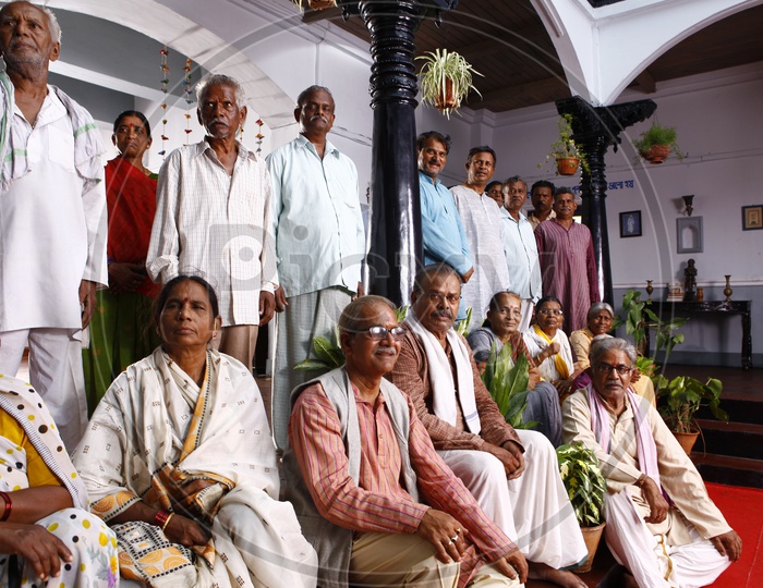 Old Men and Women Posing For a Group Photo In a Old age Home