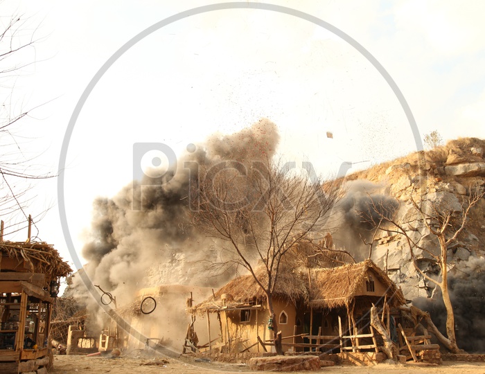 Bomb Blast In a Rural Village With Huts in Air