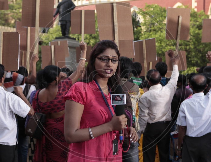 TV Reporter Or News Media Or Lady Reporter Reporting  From a Protest