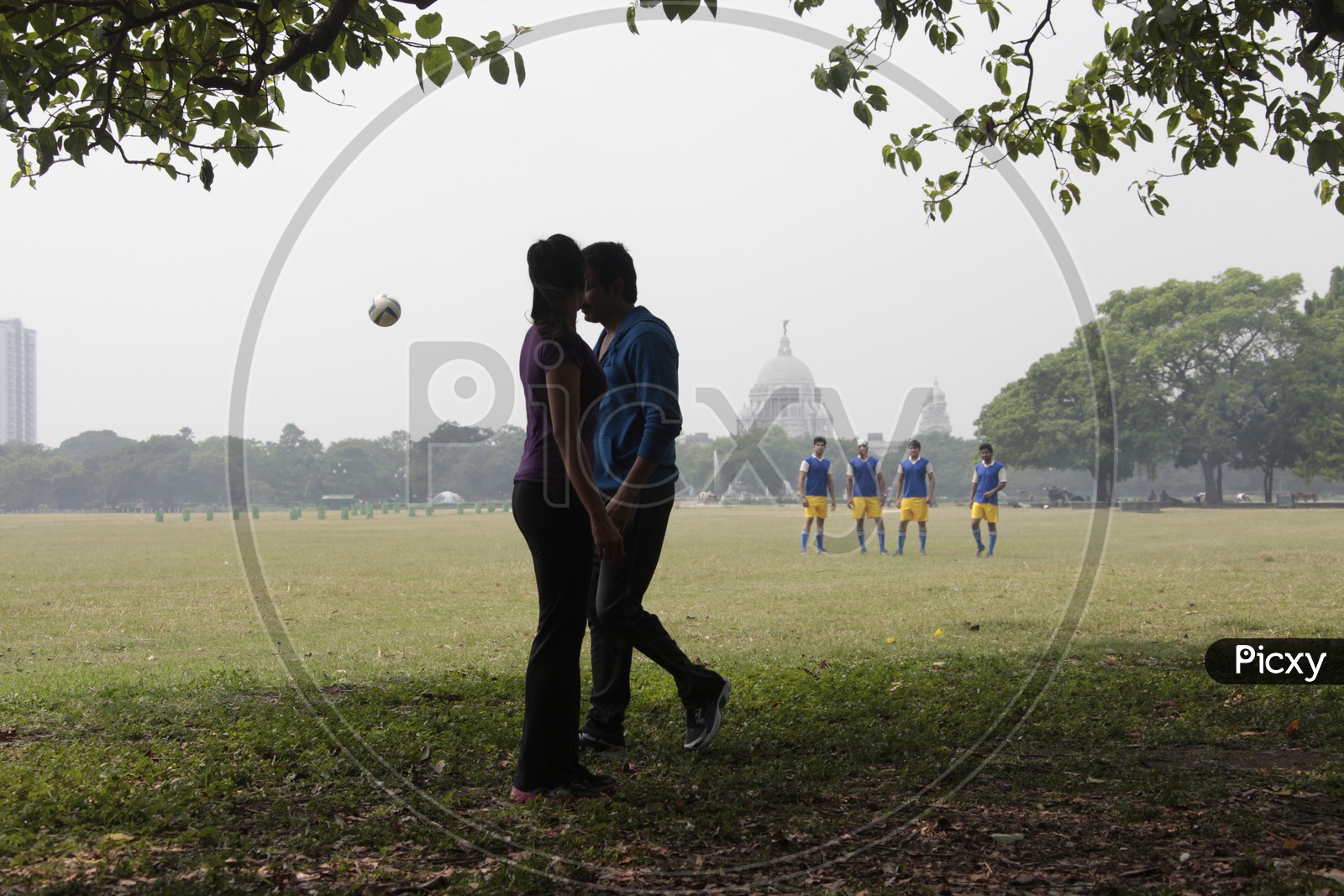 A Couple In a Football Court