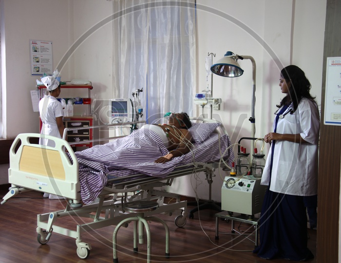 Doctors treating Patient in a Hospital Room