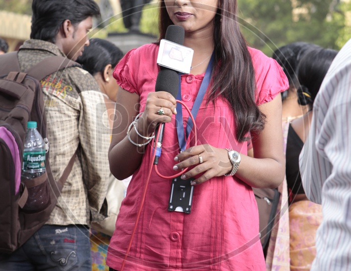 TV Reporters Or News Coverage Media Or Lady Reporters Reporting  At a Protest or Riots