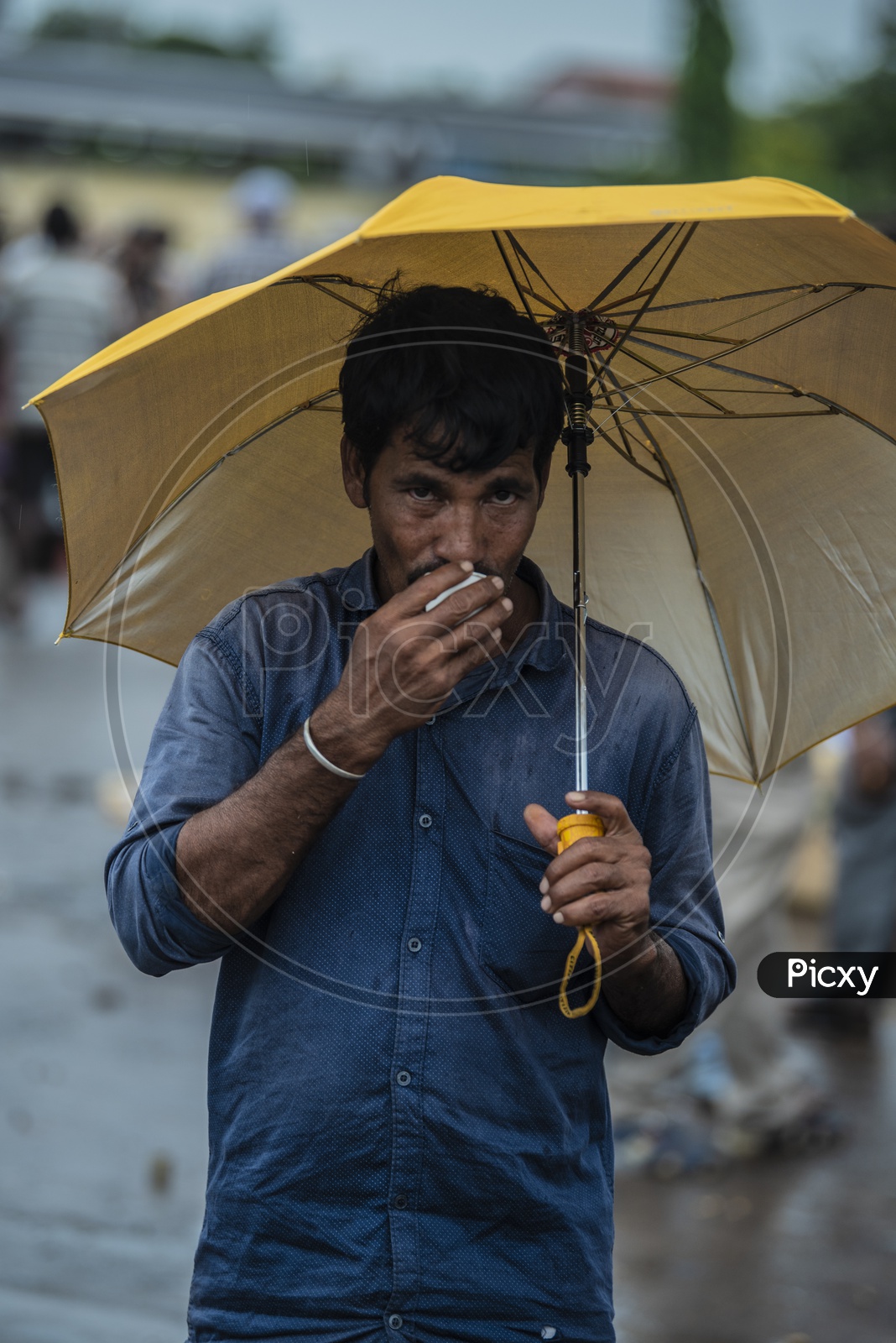 Men taking tea in rain weather