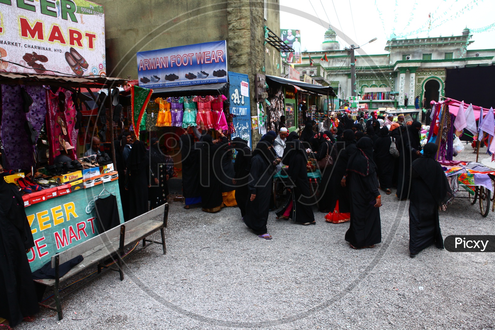Muslim Woman Shopping in a Vendor Street