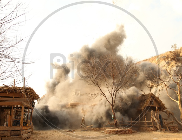 Fire Mishap in a Village With Huts Catching Fire And Thick Dark Smoke