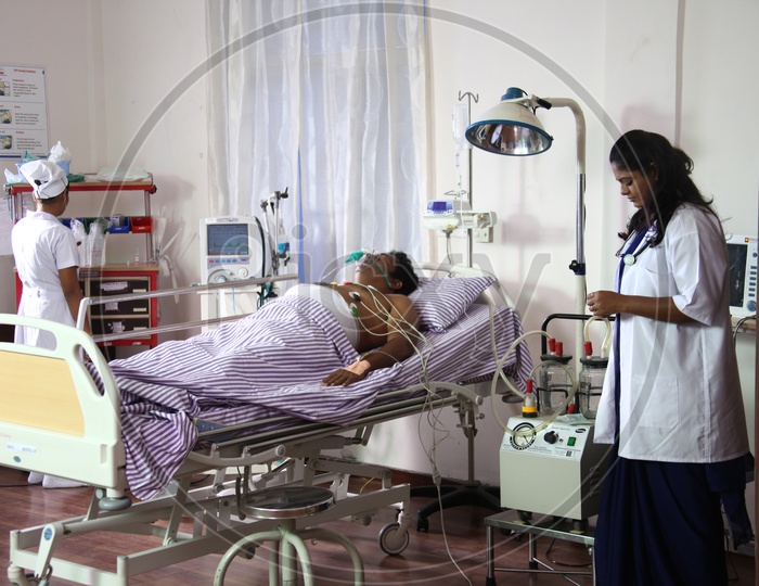 Doctors treating Patient in a Hospital Room