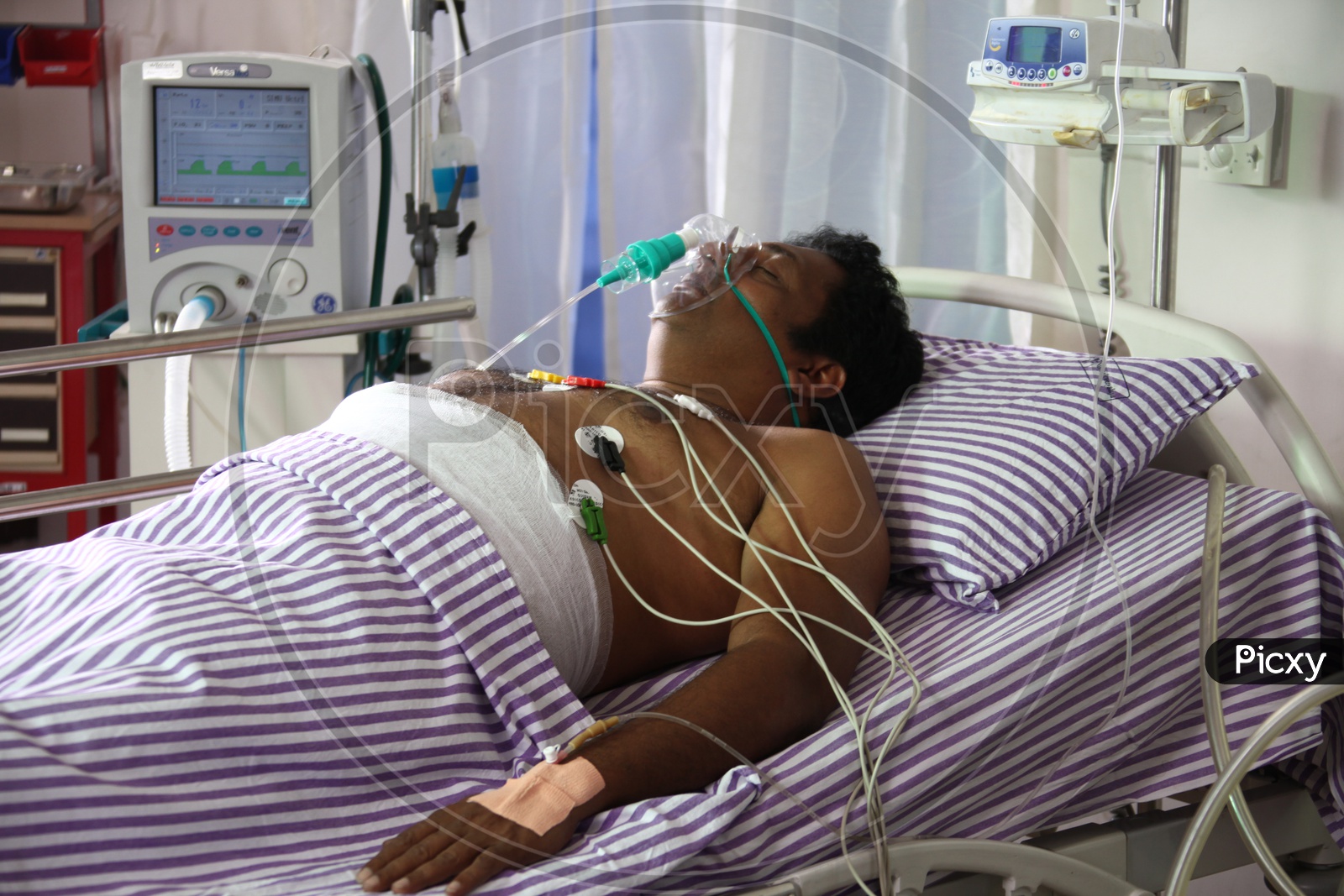 A Man On Life Support System on a Hospital Bed