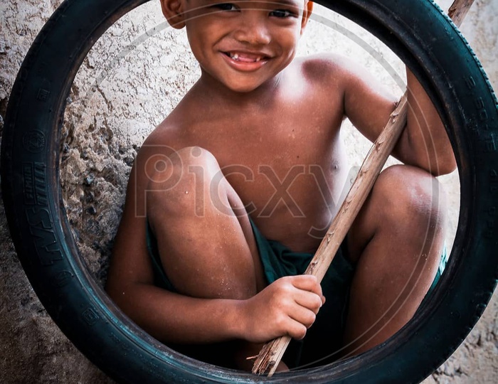 Boy with a tyre 🚴