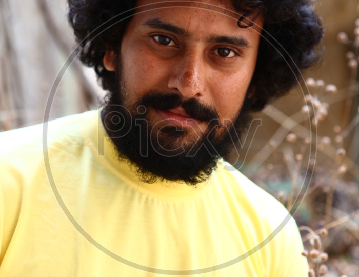 Young Indian Man With beard And Hair