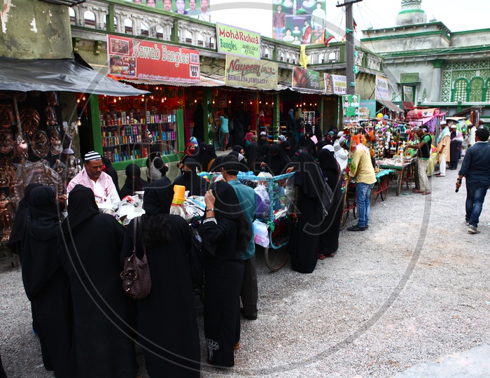 Muslim Woman Shopping in a Vendor Street